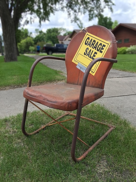 Garage sale sign and chair